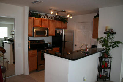 Kitchen Area showing Door to Laundry