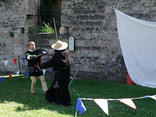 Lawless times-the Monk takes sword instruction from the Master.