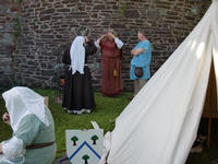 Early Brits Sue and Chris keeping the cooking fire company and getting smoked for their trouble