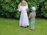 Emmy shows a guest how to play skittles