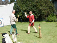 Mike learns sword skills  from Rick