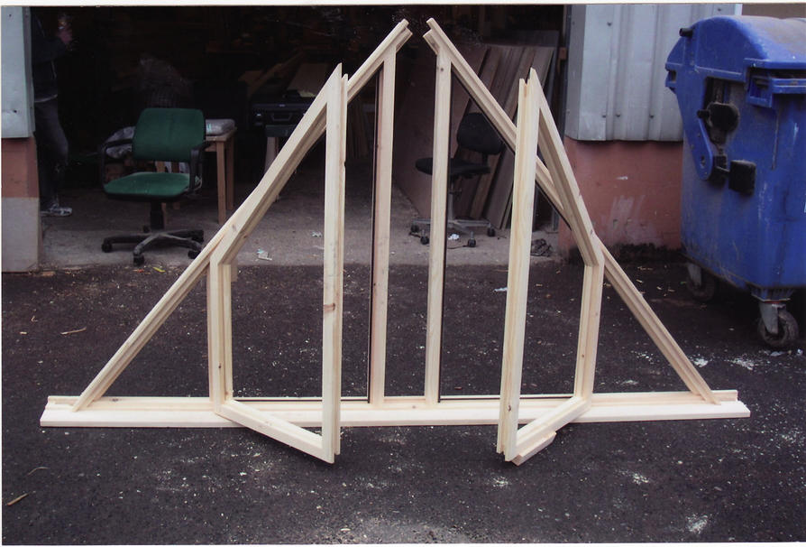Triangular shaped windows with opening sashes