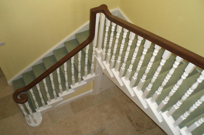 Staircase with cut strings ans a sapele handrail