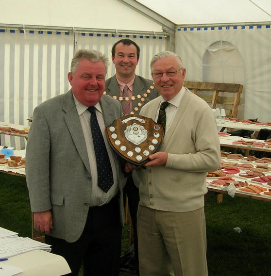 Allan Bennett receiving the Council Shield as overall sausage winner from John Holden representing one of our sponsors, Lucas Ingredients, part of the Kerry Ingredients Group