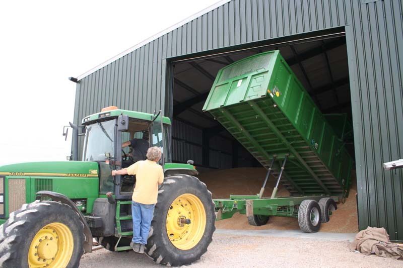 tractor and trailer unloading into store