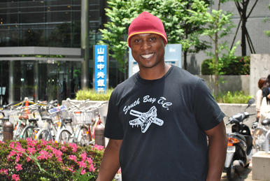 Steve Metz poses  as he tours Tokyo