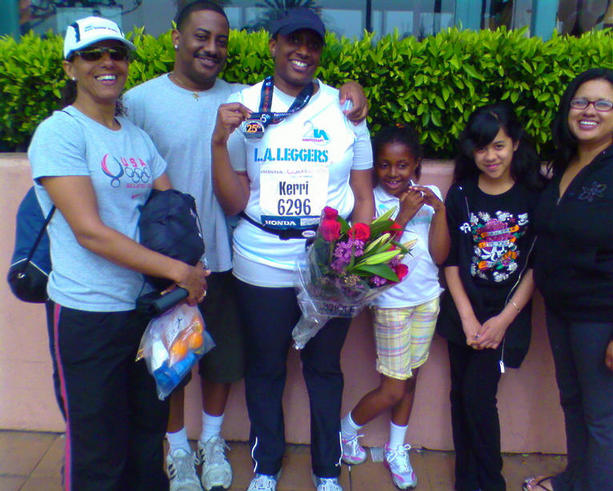Coach Webb's daughter, Kerri (center with medal) celebrates with family members.