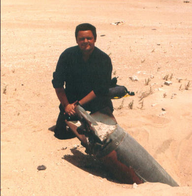 Working on an unexploded bomb in Kuwait, 1991