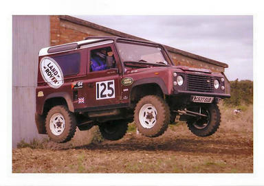 land rover jumping out of the shed