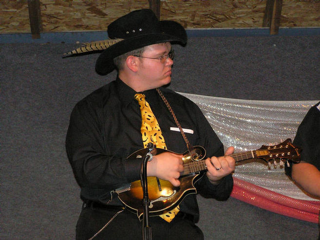 Carlton lends a hand with the mandolin