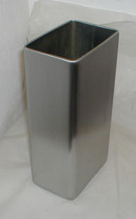 A stainless steel vase polished to a satene finish