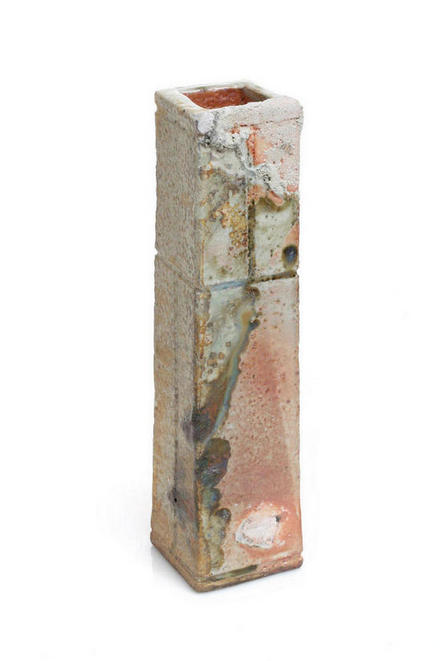 Rectangular, taperd chimney form with wood ash deposits