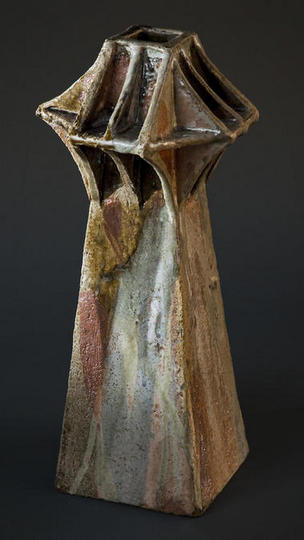 This piece has a top reminiscent of some bridge piers. Several glazes have been poured down this form and so it is rich in reduced iron colours