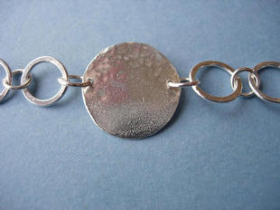 Reticulated and hammered disc.