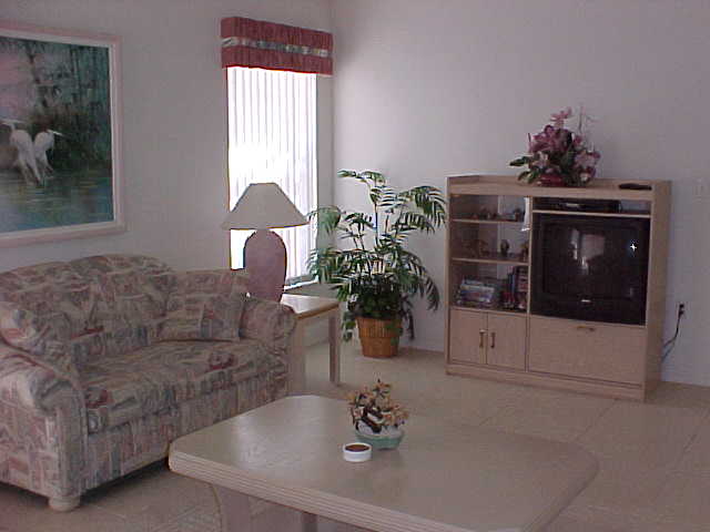LIVING ROOM W/ENTERTAINMENT CENTER