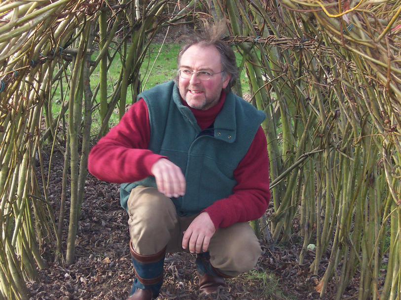 Ganesh crouching in a wintry looking willow tunel