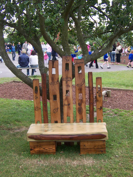 Part recycled oak/pine story telling seat with childrens drawings pyrographed on to it
