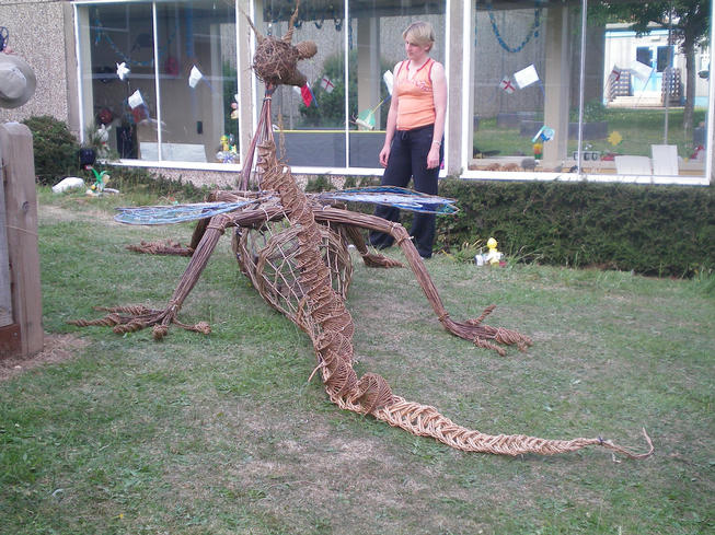 Rear view of willow dragon with teacher standing by