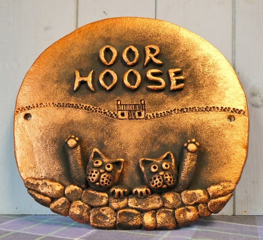 Oor Hoose with cats in copper.