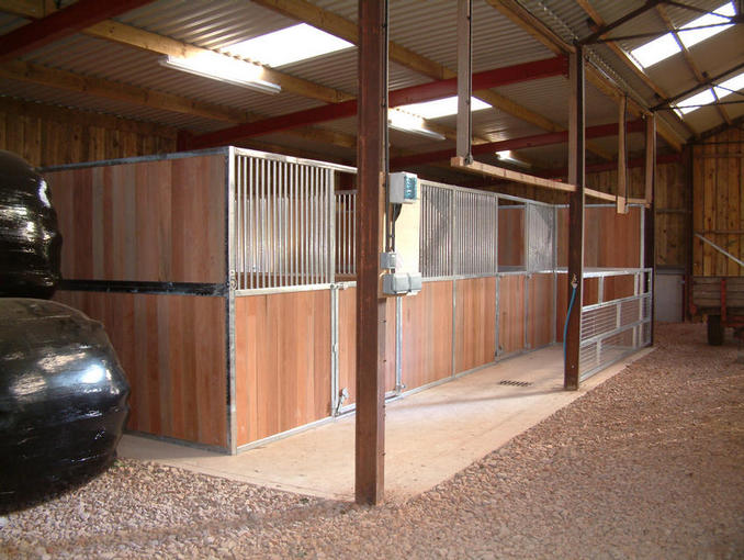 Custom internal stabling with mesh sheep gate