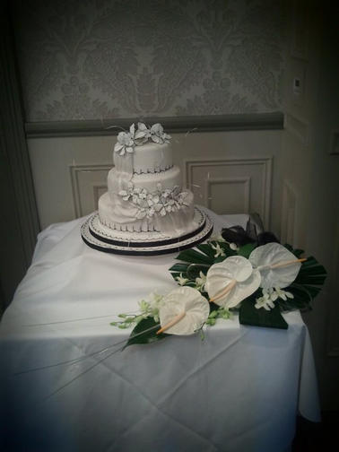 Cake Table Dressed with matching Flowers to the theme