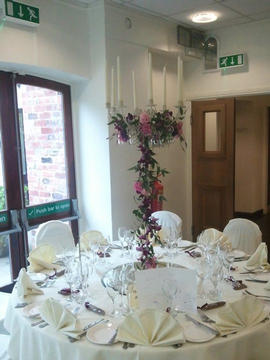 A candlelabra dress with fresh flowers